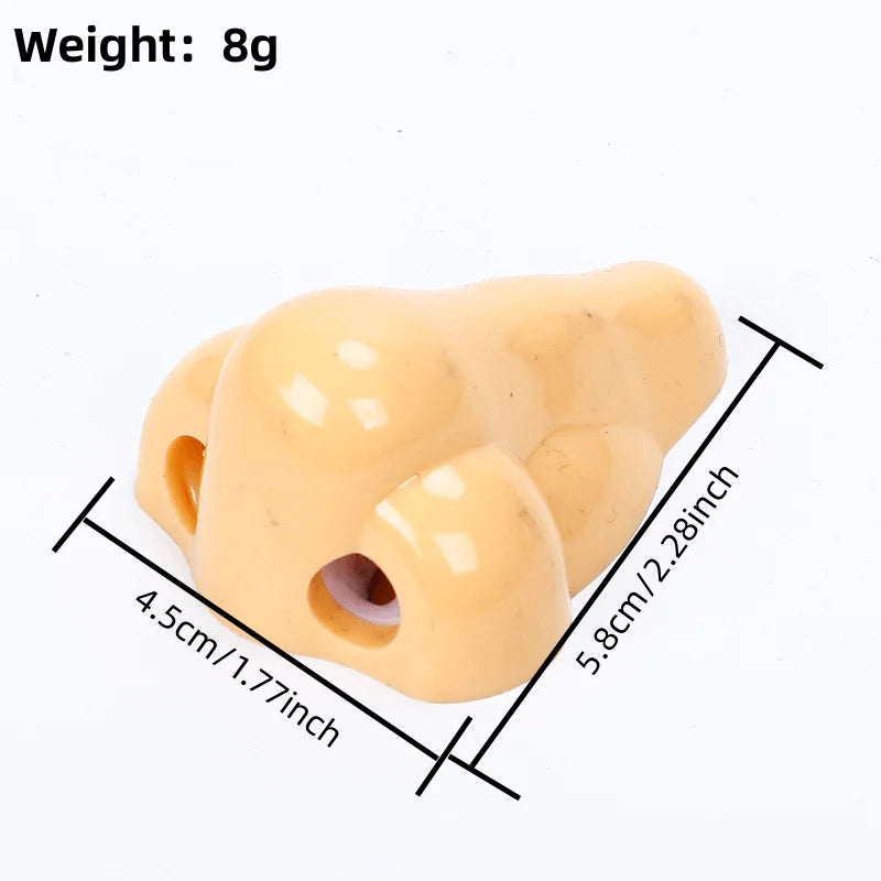 Nose-shaped pencil sharpener beige plastic with dual holes, compact kids’ school supply