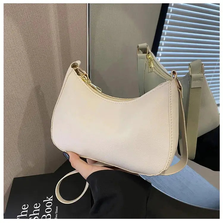 Handbags by Simples Market, cream mini square crossbody bags with gold hardware; two shown