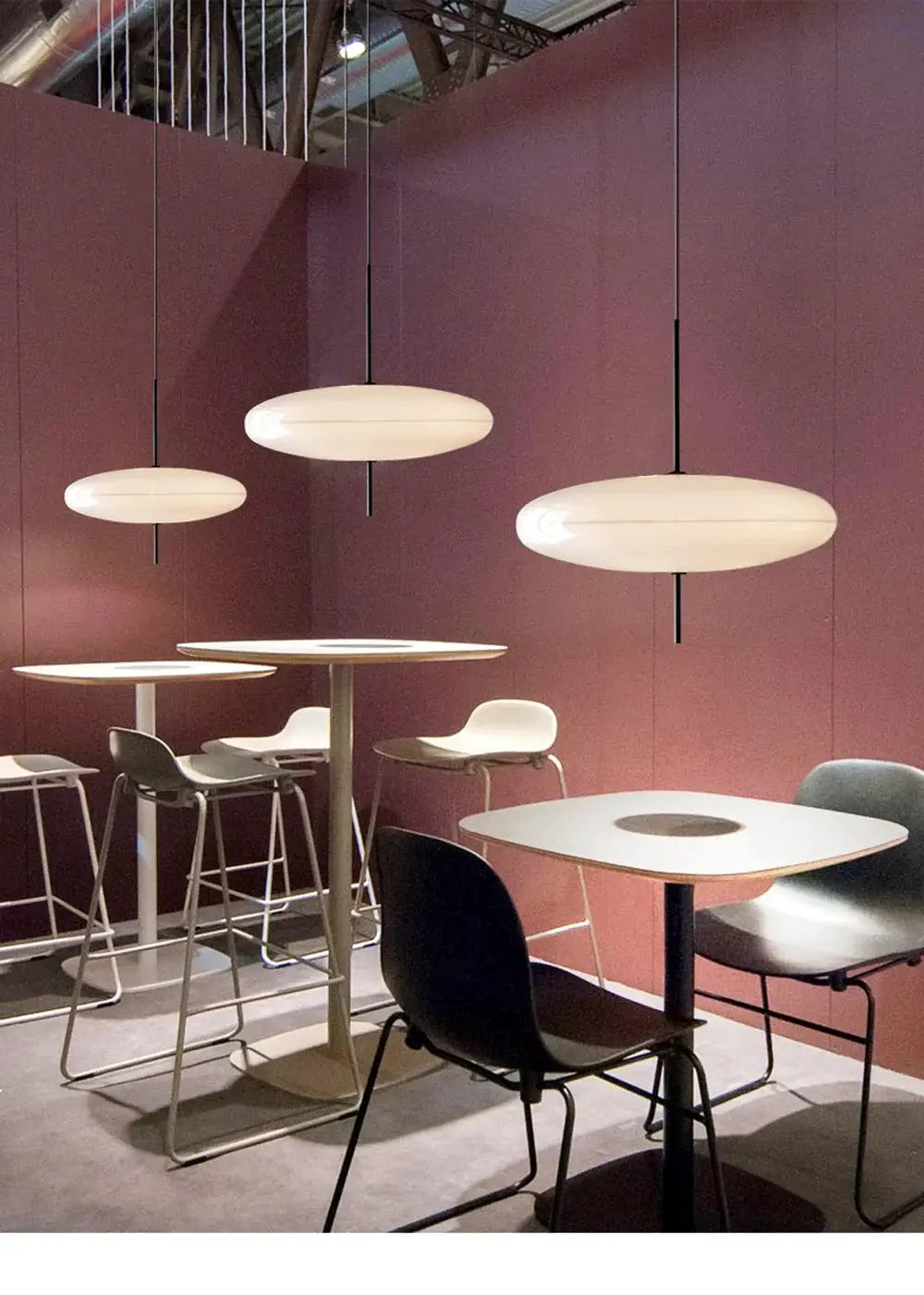 Simples Market Nordic LED pendant light, Flying Saucer design, white oval fixtures hanging over a cafe table