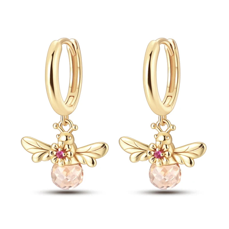 Gold-tone bee charm hoop earrings with pink crystal bead, pair from Simples Market