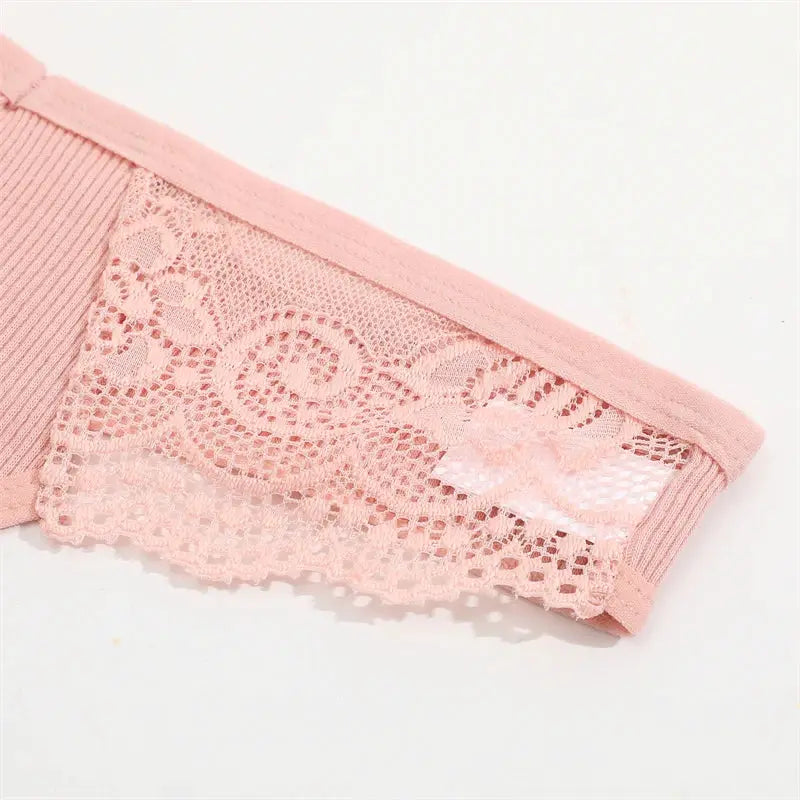 Pink lace underwear for women, low-rise bikini panties with floral pattern.