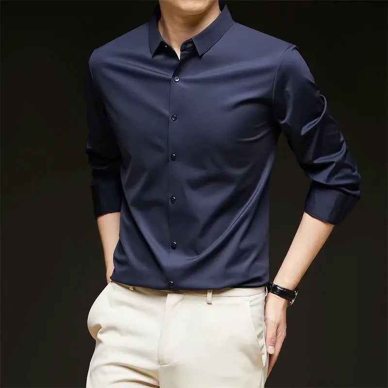 Men's navy long-sleeve business shirt, solid color, paired with beige pants
