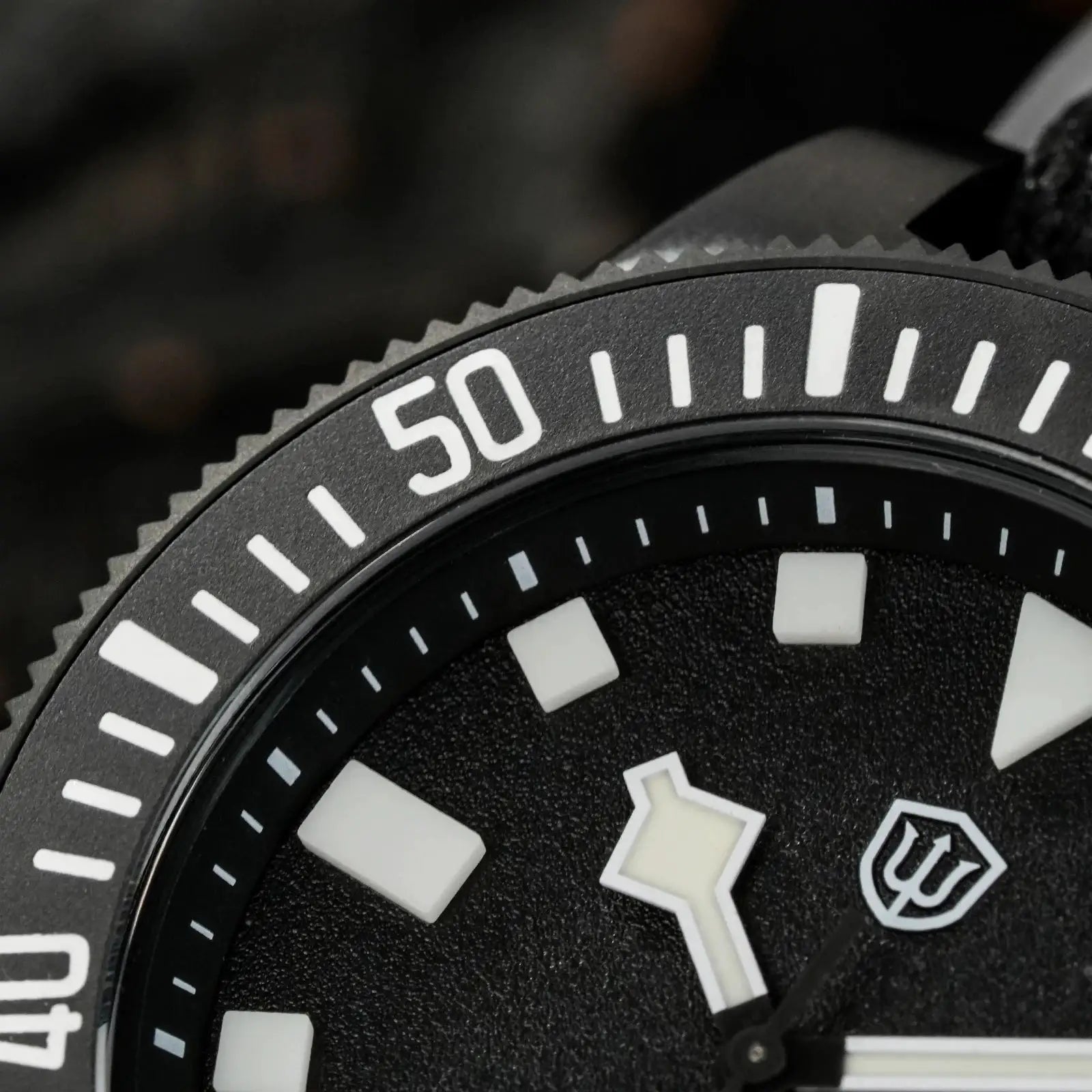 Watchdives EXD 40mm titanium dive watch; close-up bezel with bold 50 marker and luminous indices
