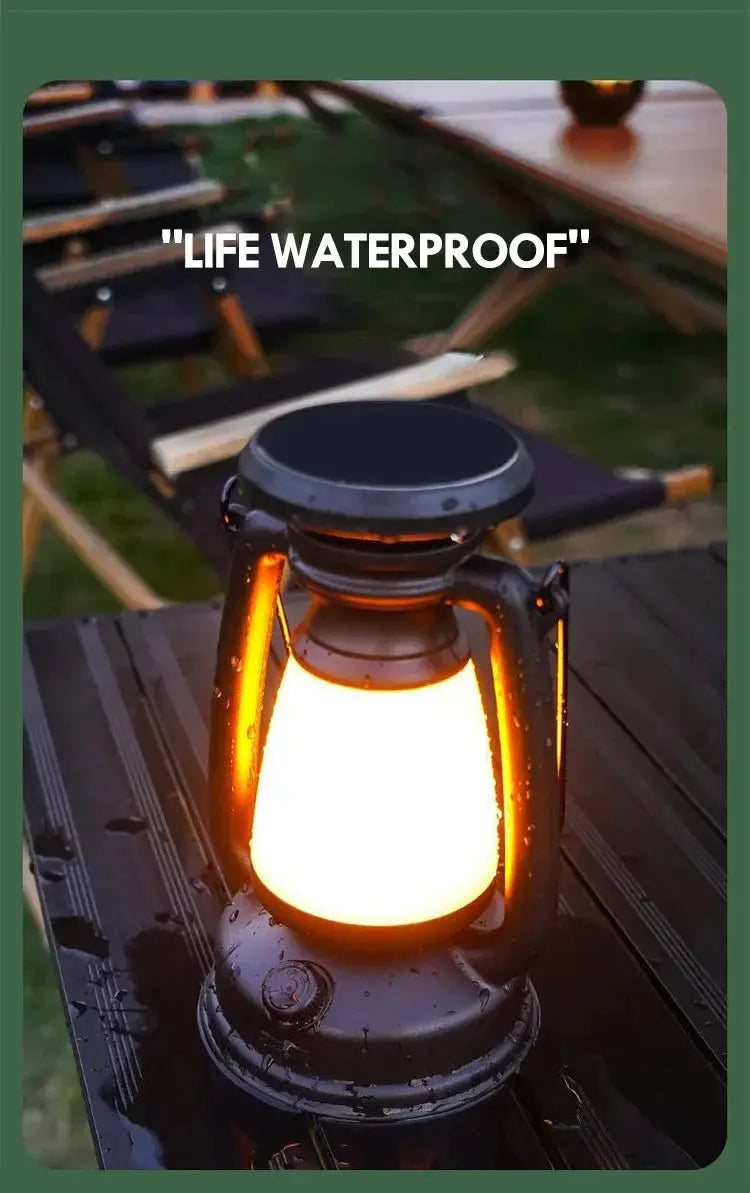 Lantern-style charging atmosphere light with black metal frame and warm orange glow for outdoor camping decor