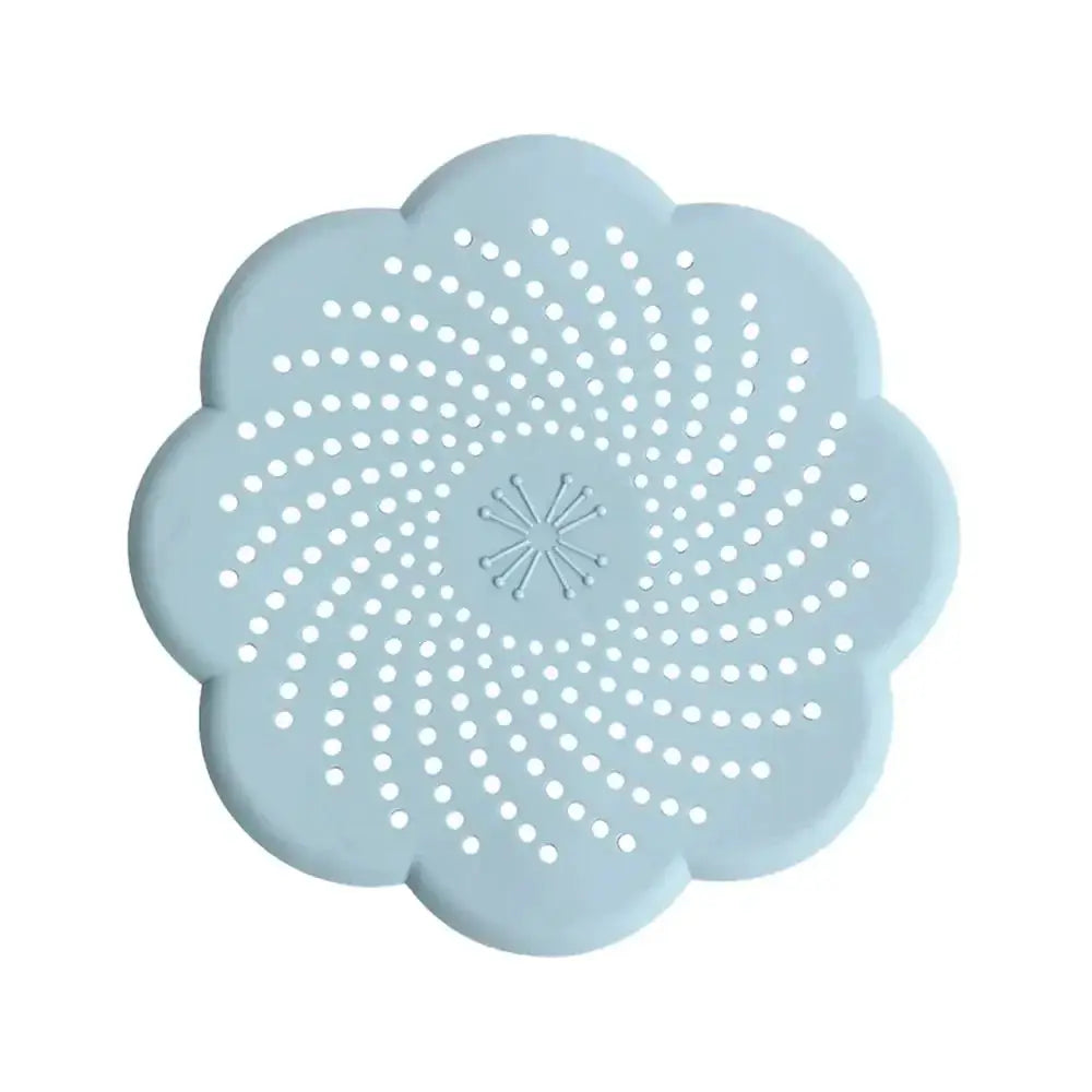 Silicone flower-shaped drain cover by Simples Market, blue with perforated mesh