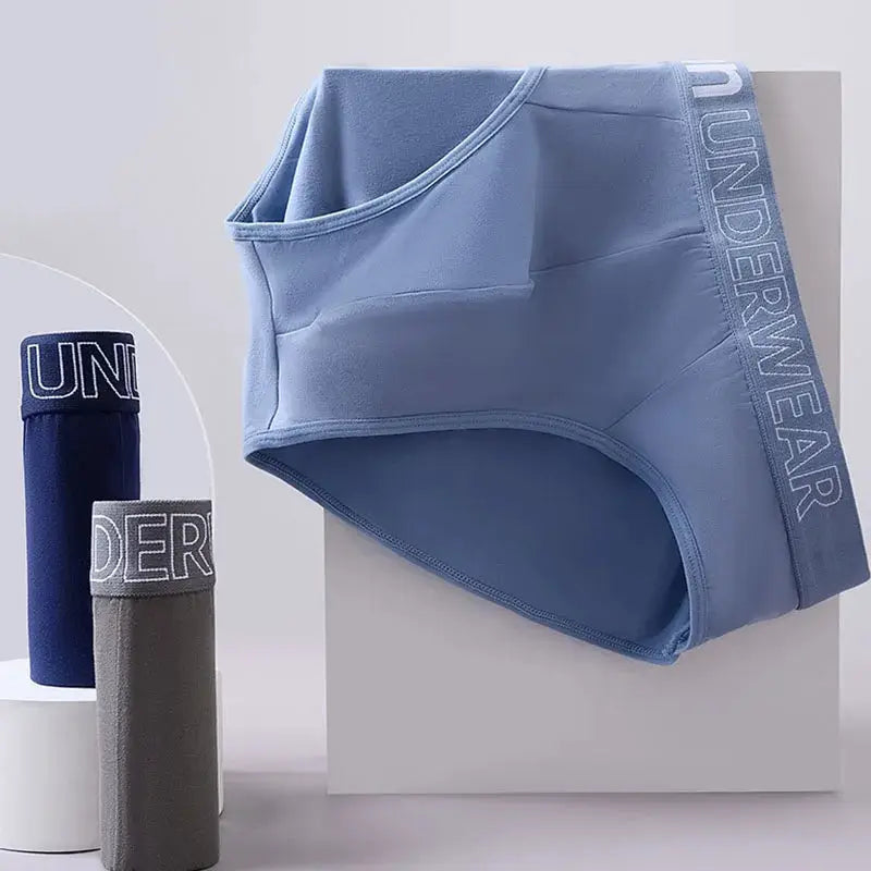 Men's letter briefs underwear 3-pack by Simples Market; light blue pair with UNDERWEAR waistband, navy and gray rolls shown.