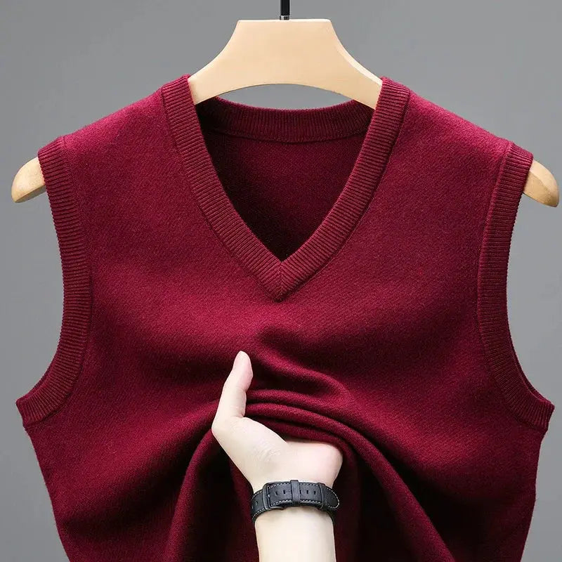 Maroon men's sleeveless V-neck knit sweater vest on a hanger