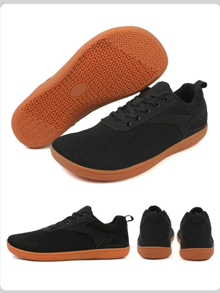 Pair of wide-toed casual sport shoes with black mesh upper and orange outsole