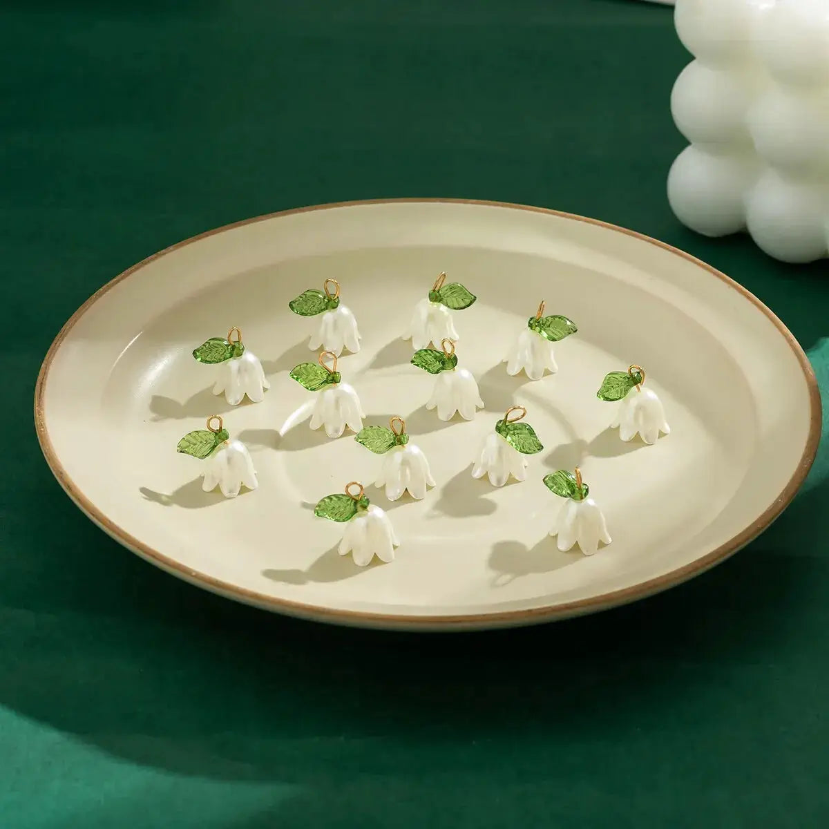 Imitation pearl bell orchid pendant charms, 10pcs set, with green leaves and gold-tone loops for DIY jewelry