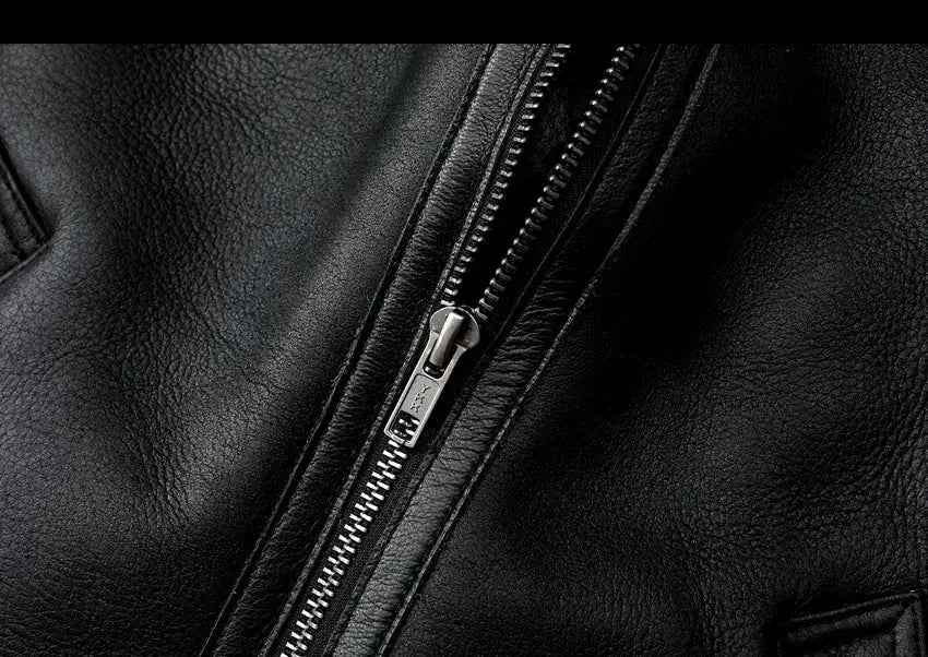 Leather jacket close-up with a silver zipper on black leather