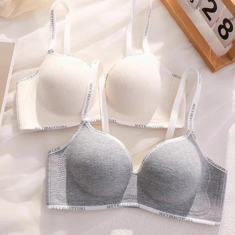 Two push-up wireless bras by Simples Market in beige and gray with adjustable straps.