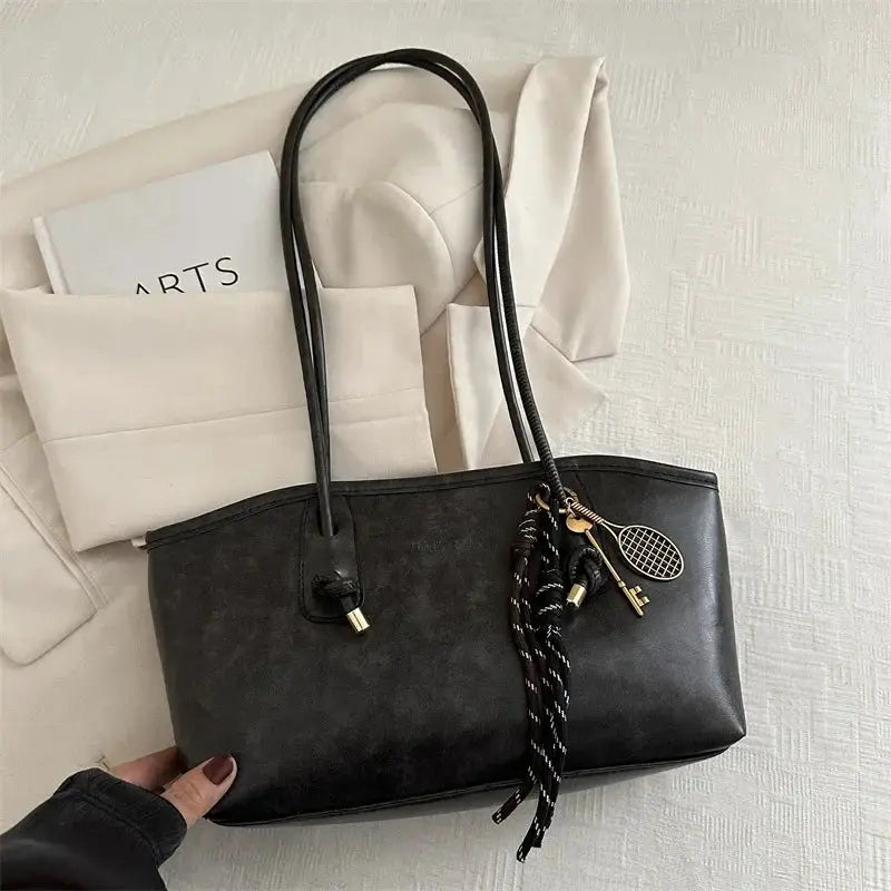 Simples Market black faux-leather tote bag, retro European American style, large-capacity shoulder handbag with pendant charms.