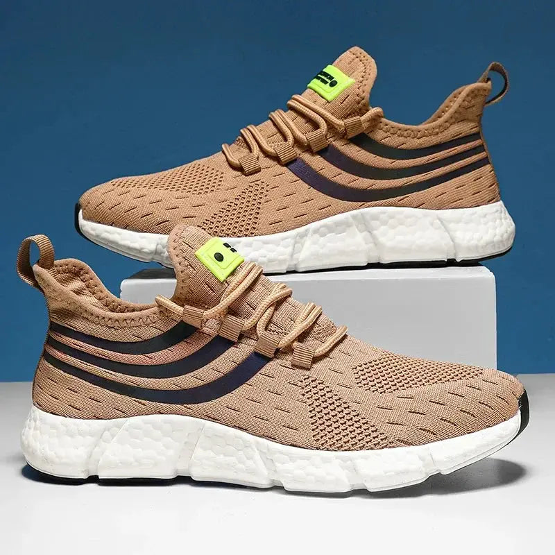 Men's tan breathable sneakers with a white platform sole, black side stripes, and neon tongue tag.