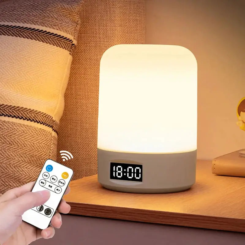 LED night lamp for bedside table with dimmable frosted shade, built-in digital clock, gray base, remote control
