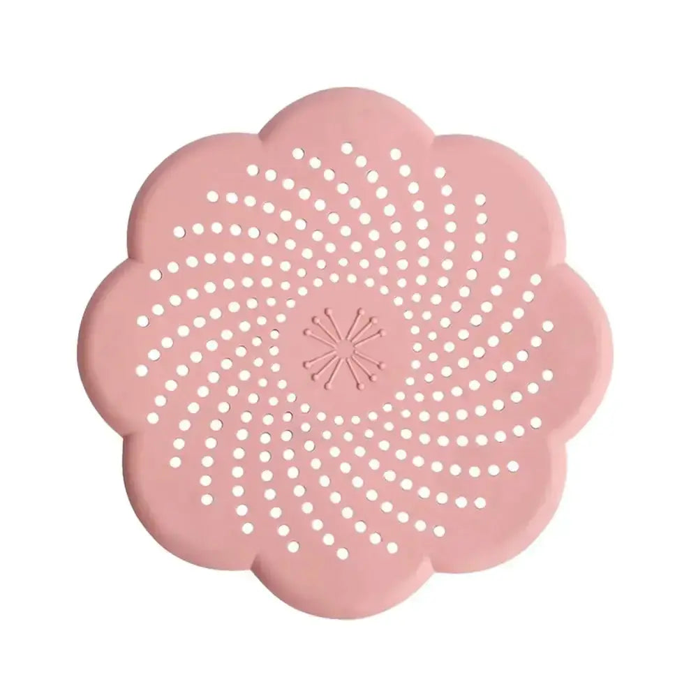 Pink flower-shaped silicone drain cover by Simples Market; kitchen sink strainer.