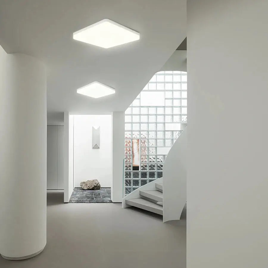 Two MARPOU square LED ceiling lamps; white modern ceiling lights with neutral white glow in a minimalist hallway.