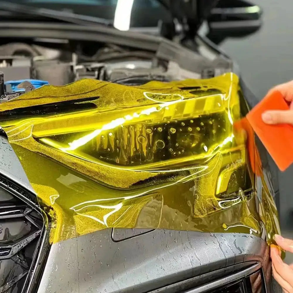 Simples Market yellow car headlight tint vinyl film being applied to a headlight; self-adhesive PVC waterproof sticker