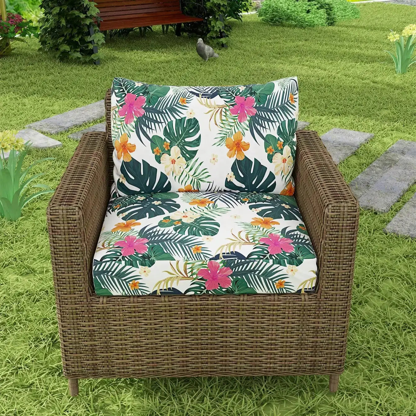 Outdoor tropical-print sofa cushions; two cushions with green leaves and pink/orange flowers on white background on a wicker chair.