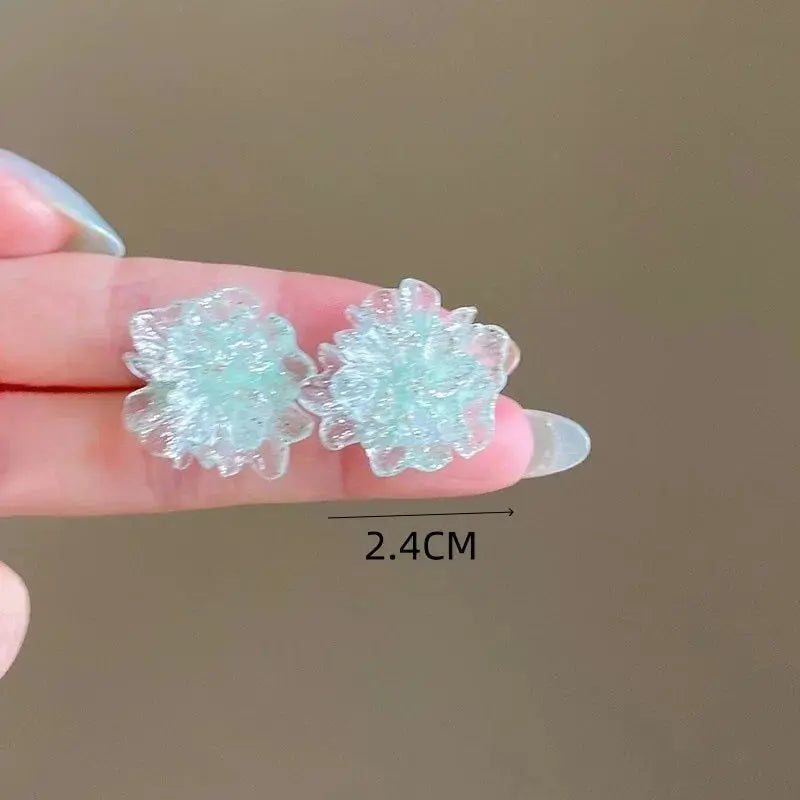 Pair of white flower stud earrings with translucent petals, 2.4 cm wide