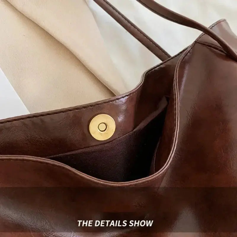 Women brown PU leather tote bag with inner pocket, gold snap closure and shoulder strap