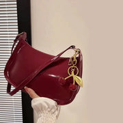 Women's burgundy PU leather shoulder bag with cherry pendant charm