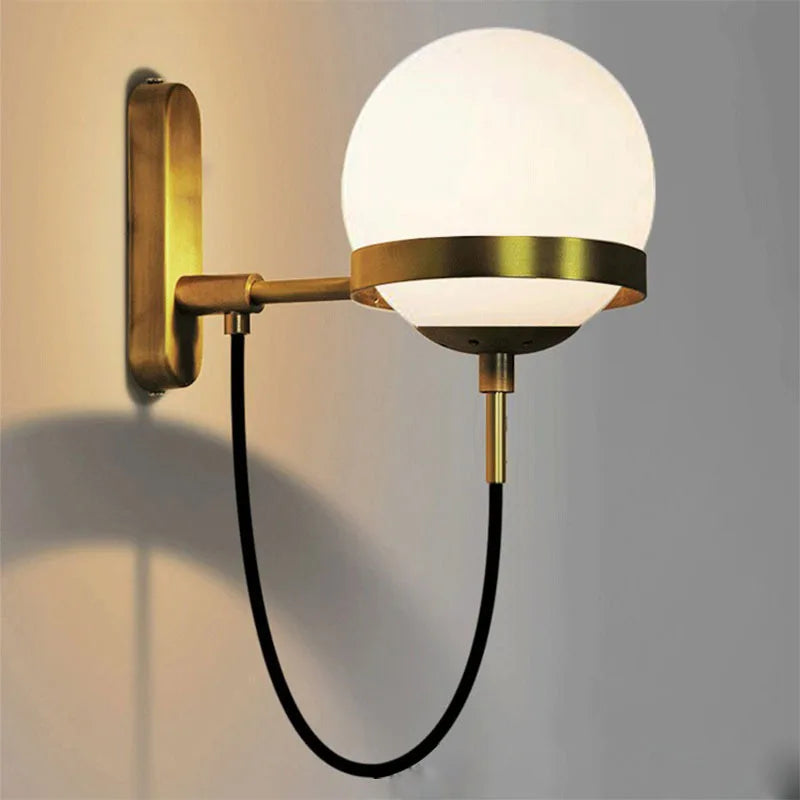 Simples Market modern glass ball wall lamp, wall-mounted with brass arm, round frosted globe and black cord
