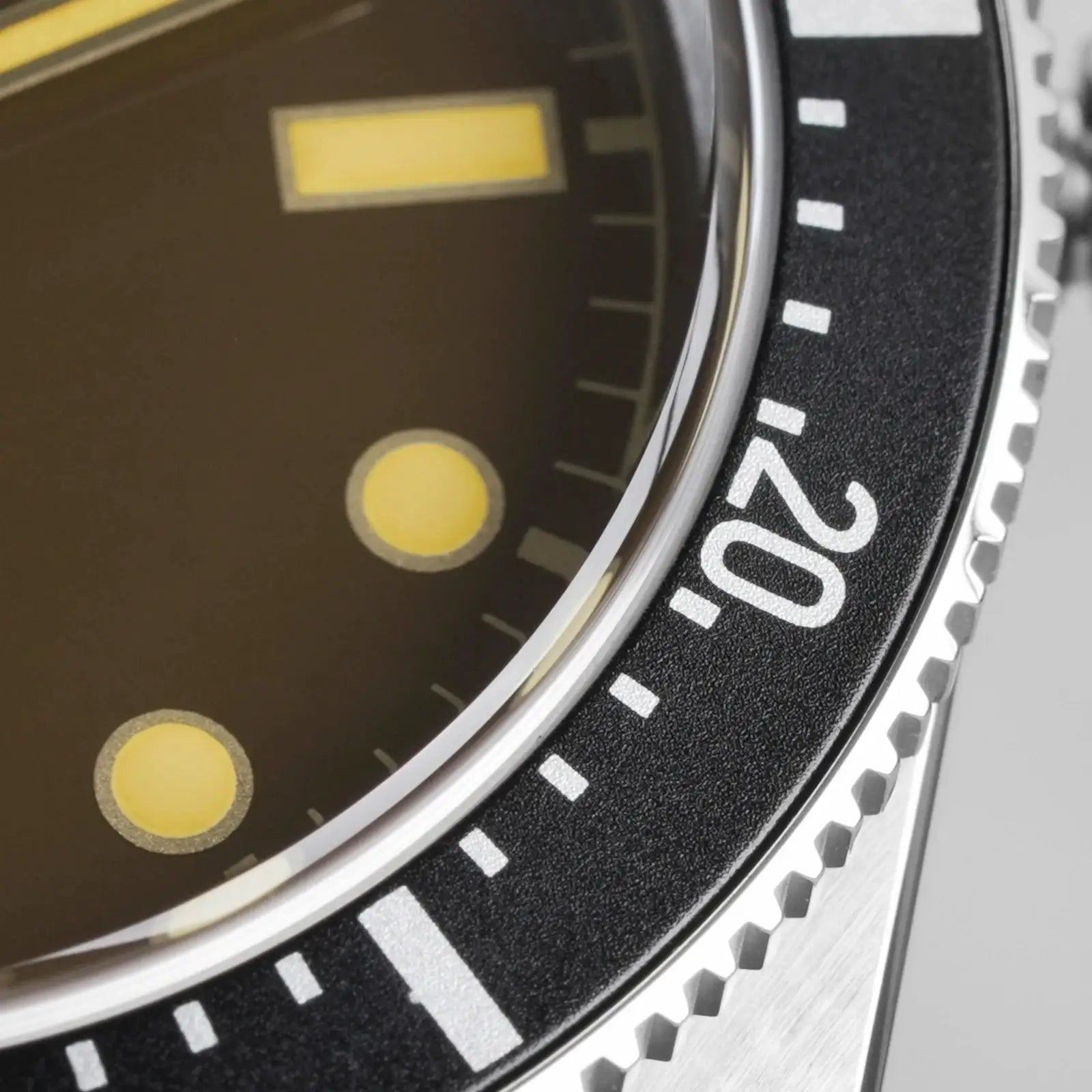Watchdives WD7922 BB54 diver watch close-up: black dial with luminous yellow markers, silver bezel and steel case