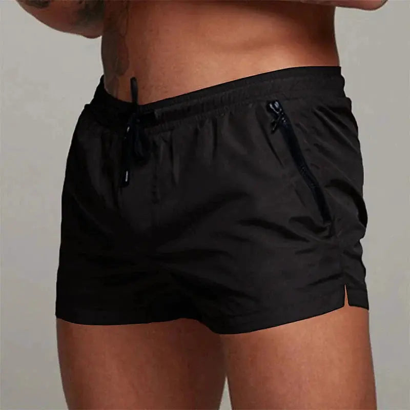 Men's black swim shorts with drawstring waist and side zip pocket.