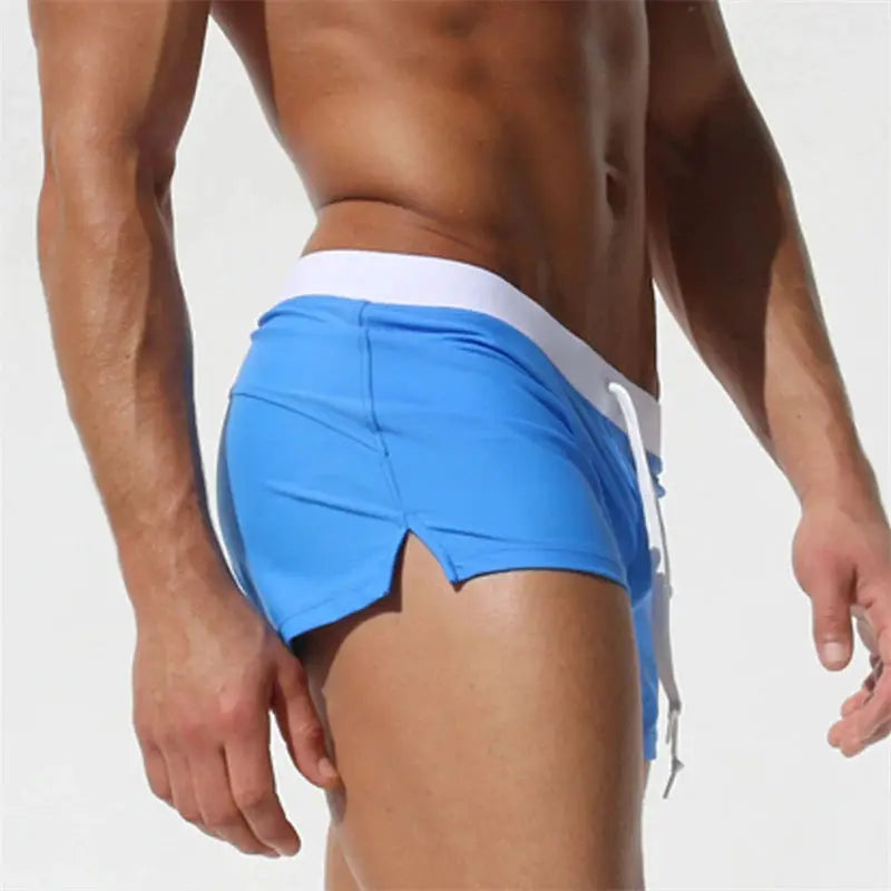 Men's blue quick-drying swim trunks with white drawstring waistband
