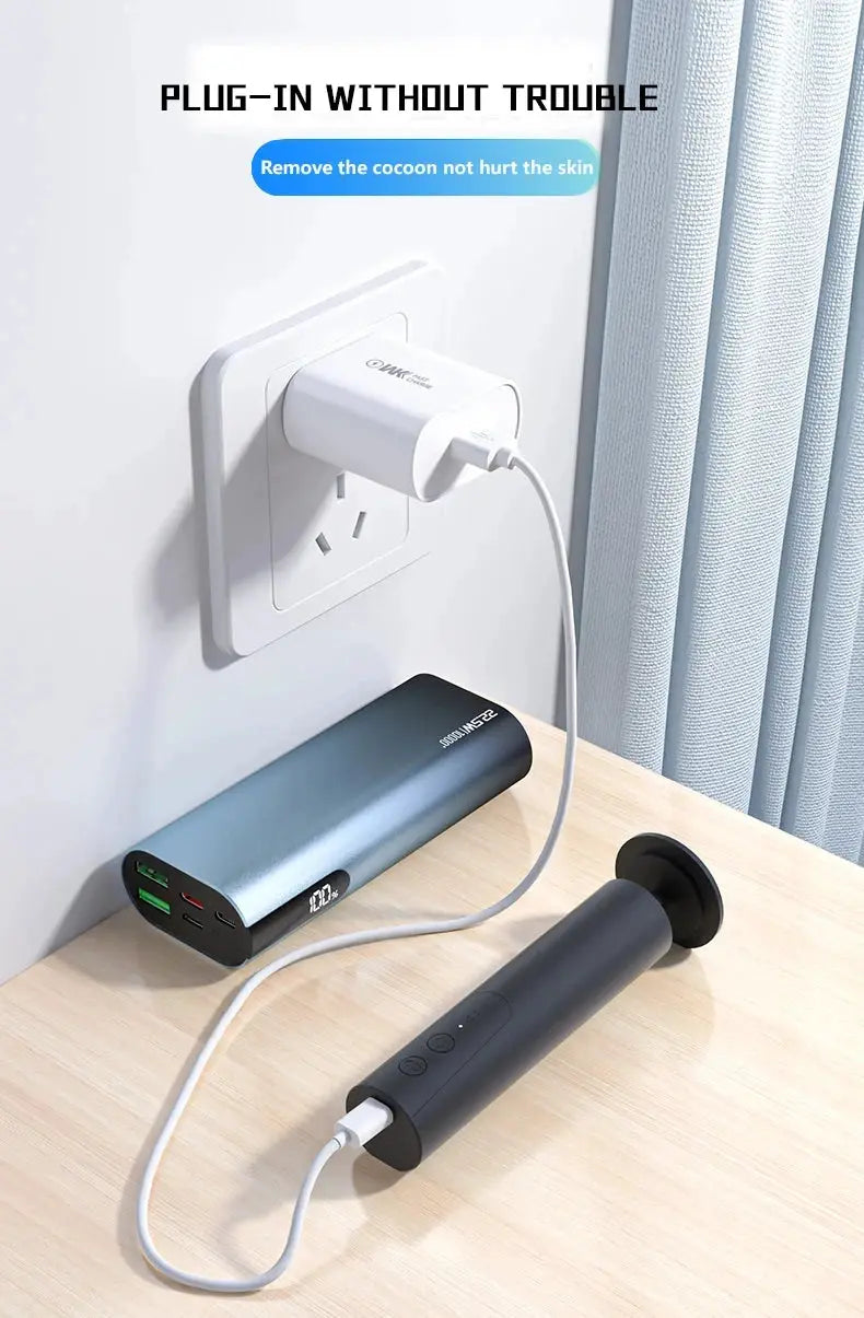 Simples Market electric foot callus remover in dark gray with USB charging cable connected to a power bank