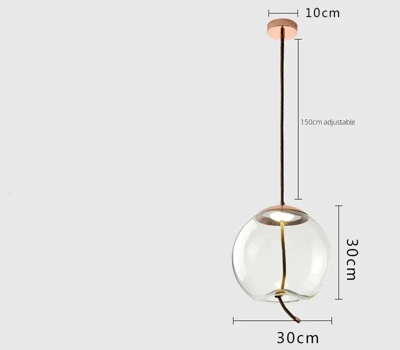 Minimalist pendant lamp by Simples Market; glass globe with hemp rope cord and copper hardware, 30 cm diameter