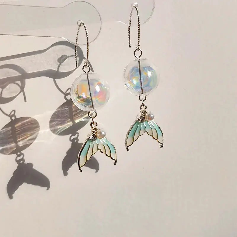 Goldfish drop earrings, clear iridescent globe beads with teal wing charms and pearl accents, pair