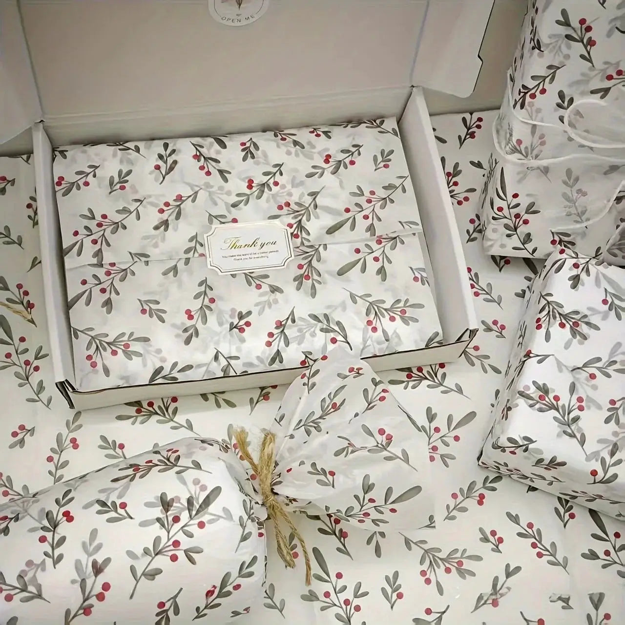 Gift wrap sheets set by Simples Market; holly berry pattern on wax-coated white paper