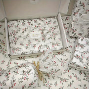 Gift wrap sheets set by Simples Market; holly berry pattern on wax-coated white paper