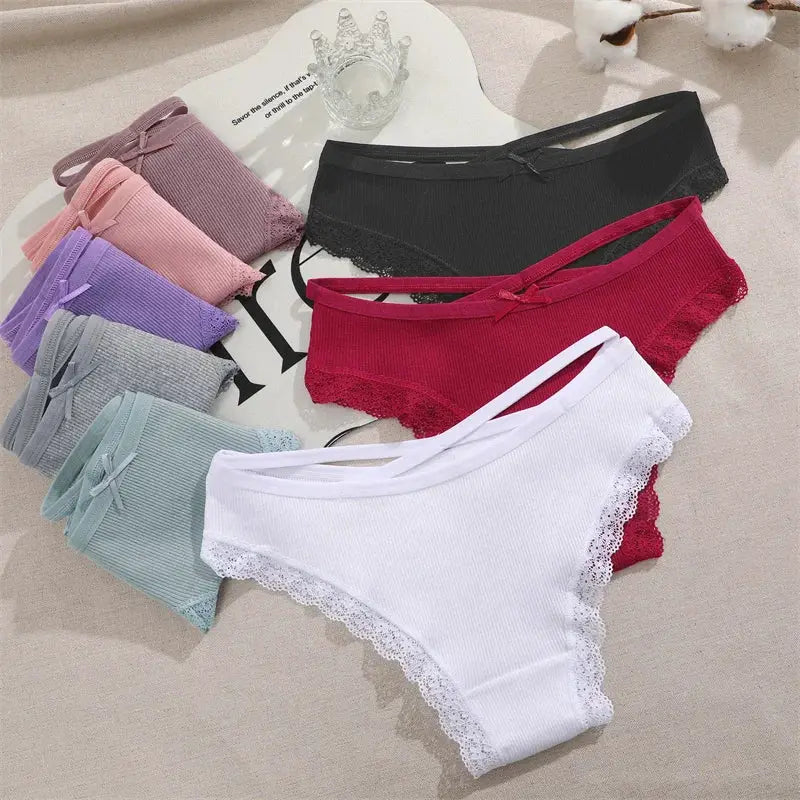 Women's lace-trimmed cotton panties set in multiple colors with bows and low-rise design