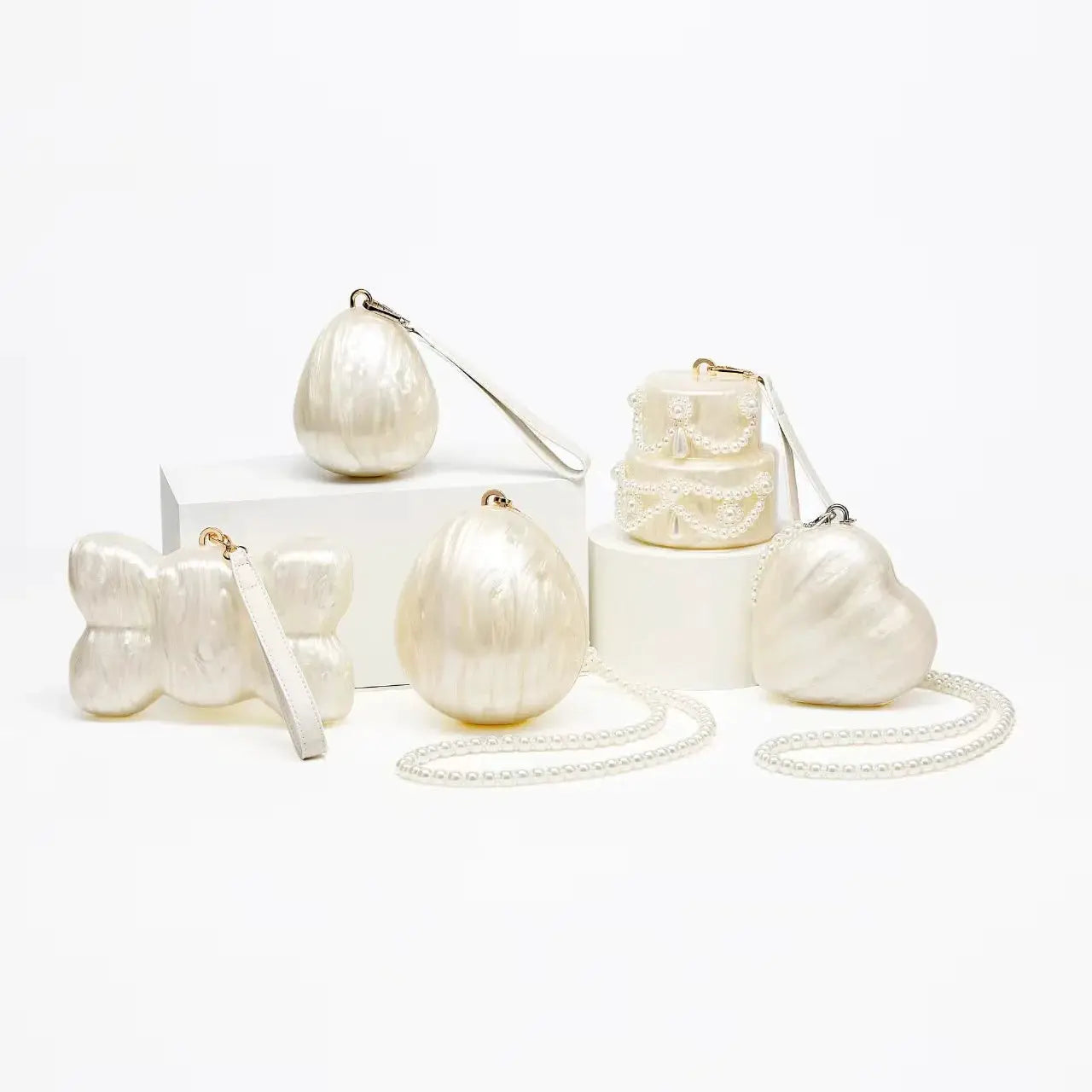Simples Market ivory acrylic egg bag set of 5 pearl-beaded evening clutches