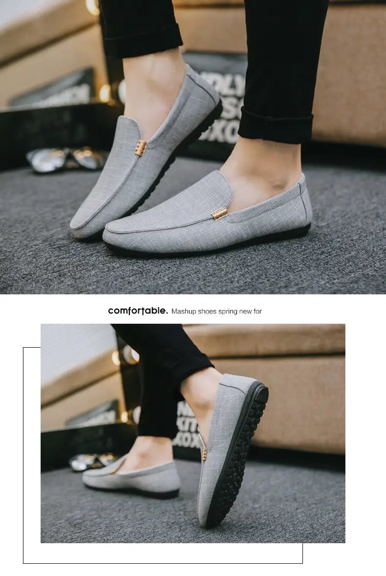 Pair of men's gray canvas slip-on loafers with gold hardware and black sole.