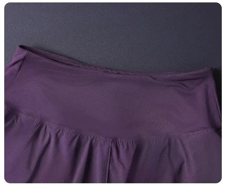 Women's 2-in-1 shorts in purple with elastic waistband in lightweight breathable fabric.