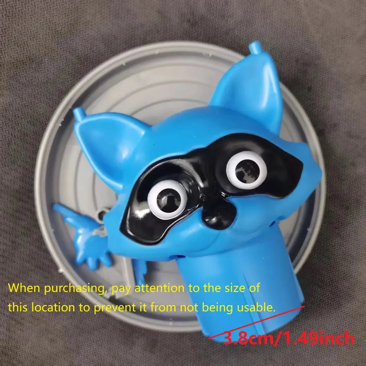 Toilet paper holder with a blue dog-raccoon figure by Simples Market for bathroom decor