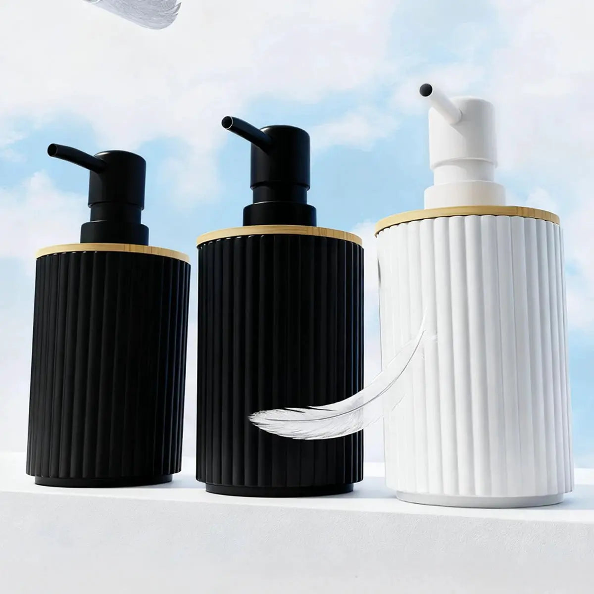 Simples Market 3-piece ribbed bathroom accessory set with black and white soap dispensers and gold trim