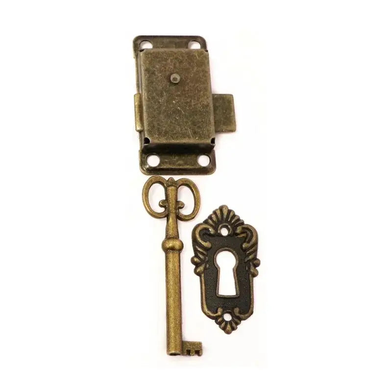 Antique brass cabinet door lock set with ornate key and matching keyhole plate