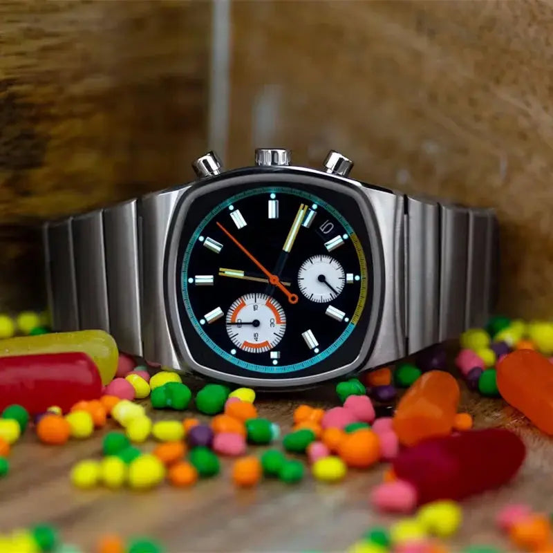 Men's square stainless steel chronograph watch with black dial, colorful bezel, and two white subdials