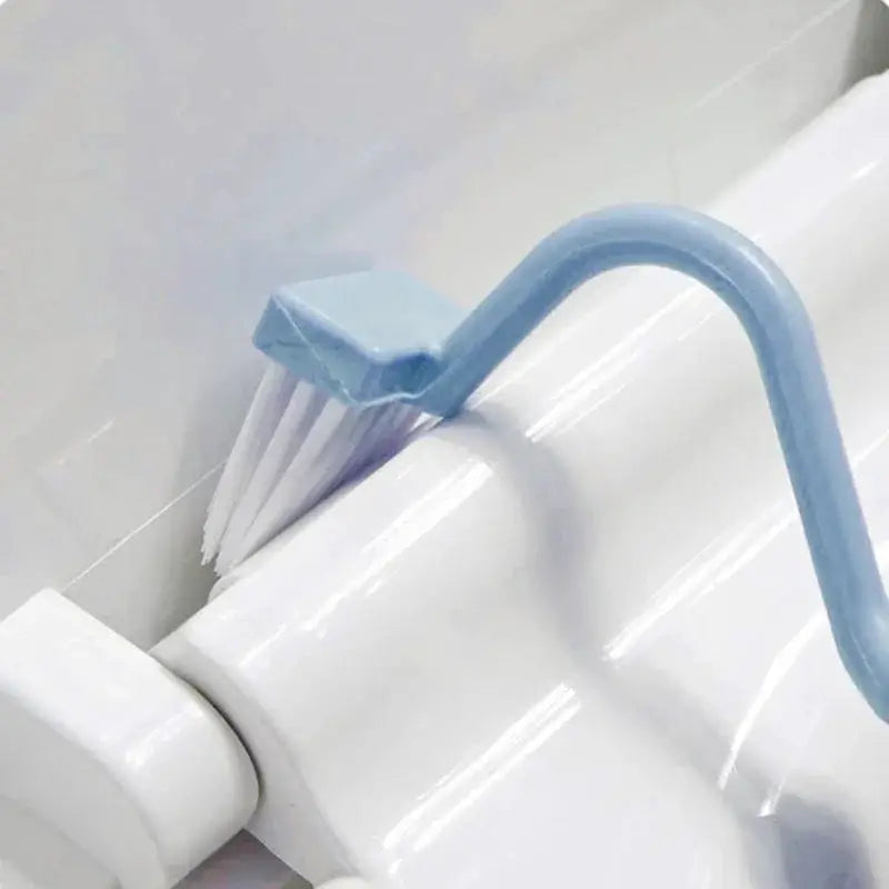 Toilet cleaning brush, S-shaped with curved blue handle and white bristles, corner WC scrubber.