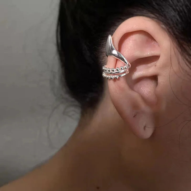 Elf ear clip earrings in silver-tone metal with geometric ear cuff and long beaded chain tassels
