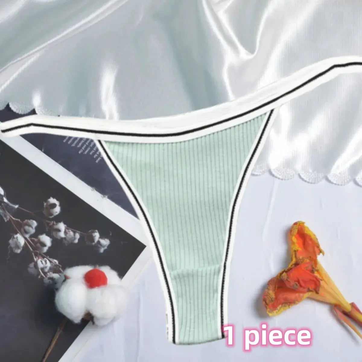 Women's mint green cotton thong underwear with seamless low-rise cut and white trim