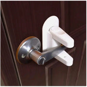 White plastic universal door lever safety lock with metal latch; adhesive mount for childproofing doors.