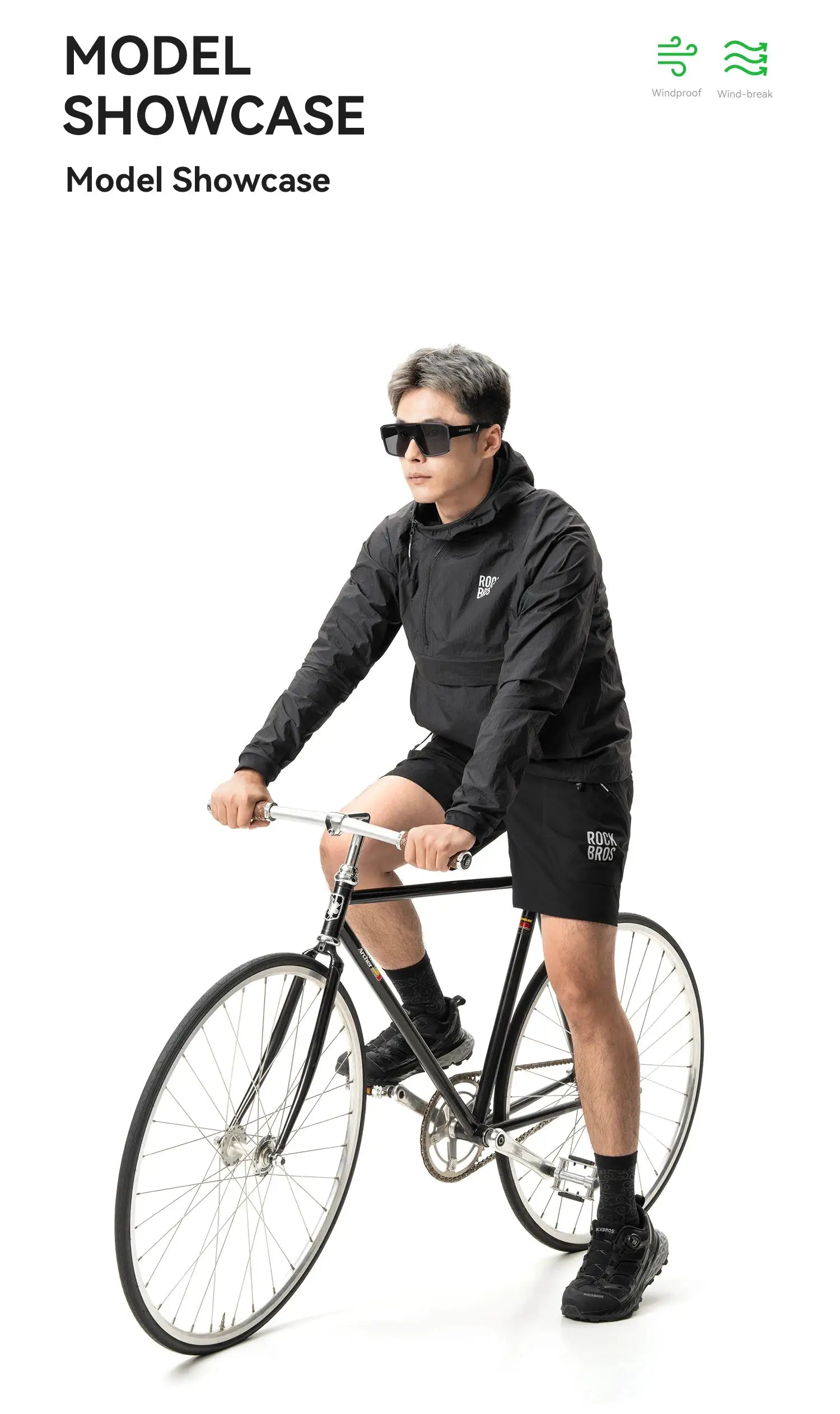 ROCK BROS black waterproof cycling jacket with detachable pocket worn by cyclist on a bike