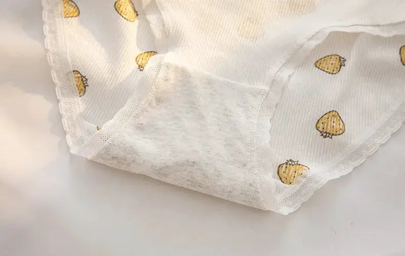 Women's cotton briefs, white mid-rise underwear with small yellow flower print and seamless lace trim.