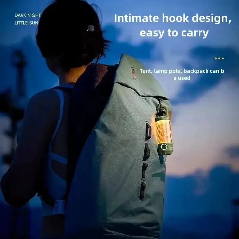 Outdoor LED camping light attached to a backpack; green, rechargeable lantern