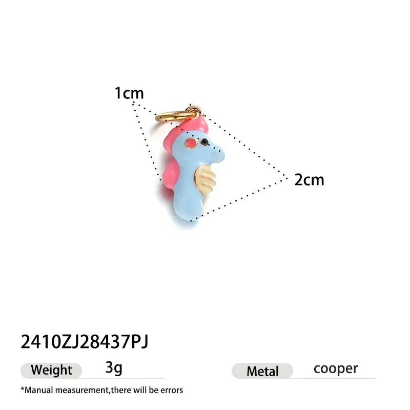 Cartoon dinosaur pendant single hoop earring, blue body with pink crest and gold-tone wings.